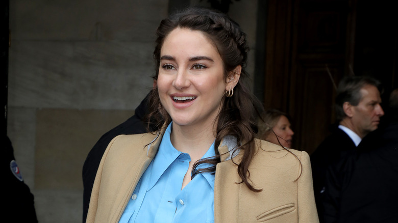 Shailene Woodley smiles at an event 