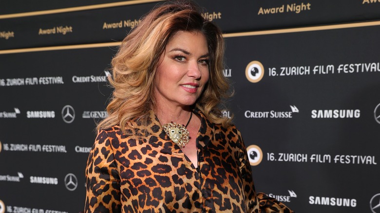 Shania Twain in leopard smiling