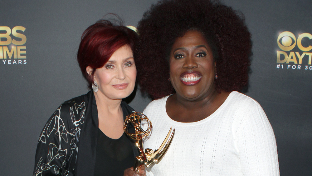 Sharon Osbourne and Sheryl Underwood smiling together on the red carpet 