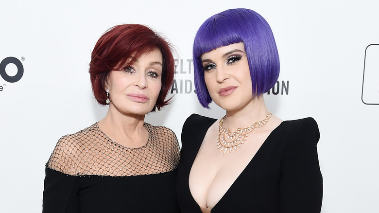 Sharon and Kelly Osbourne stand together