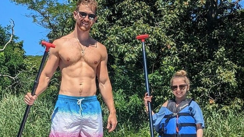 Dan Swygart and Shauna Rae paddle-boarding 