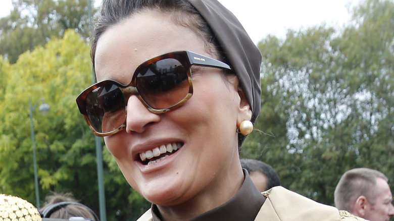 Sheikha Moza smiling in sunglasses