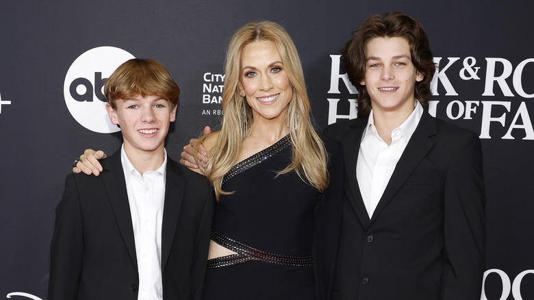 Sheryl Crow smiling with her two sons