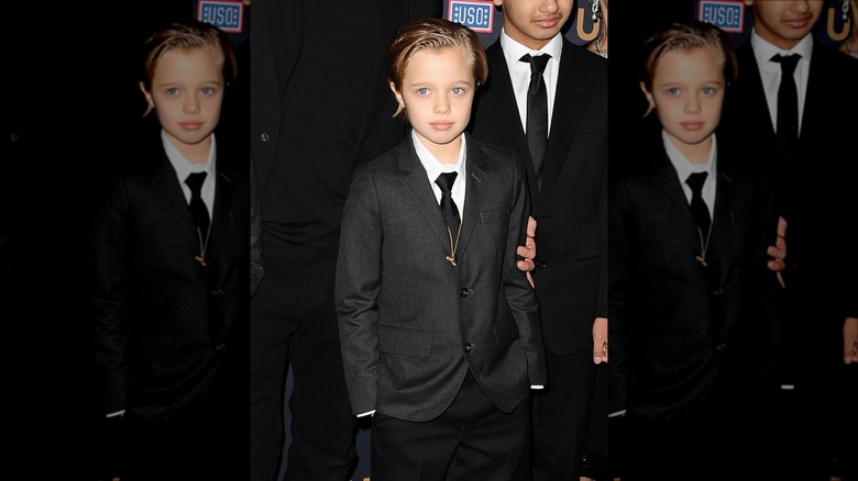 Young Shiloh Jolie-Pitt wearing a suit 