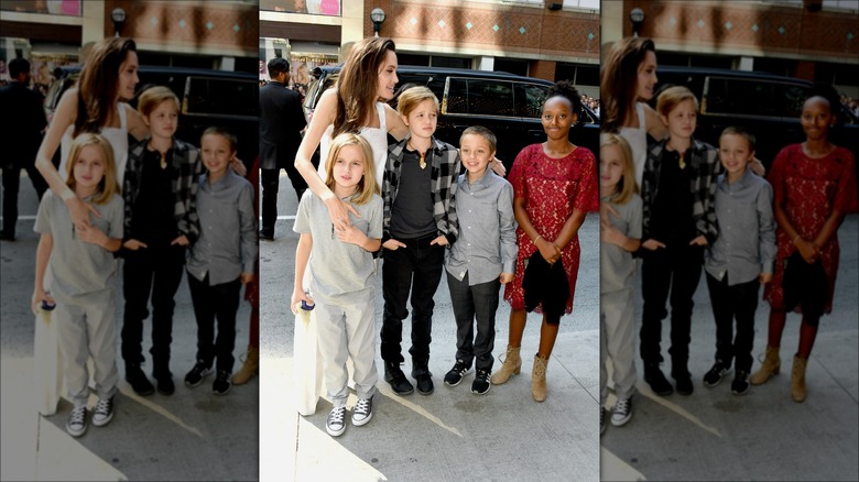 Angelina Jolie posing with her children 