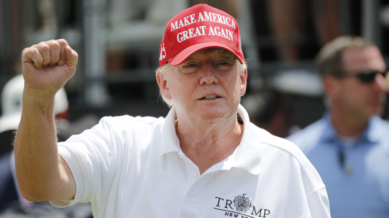 Donald Trump raised fist at golf tournament