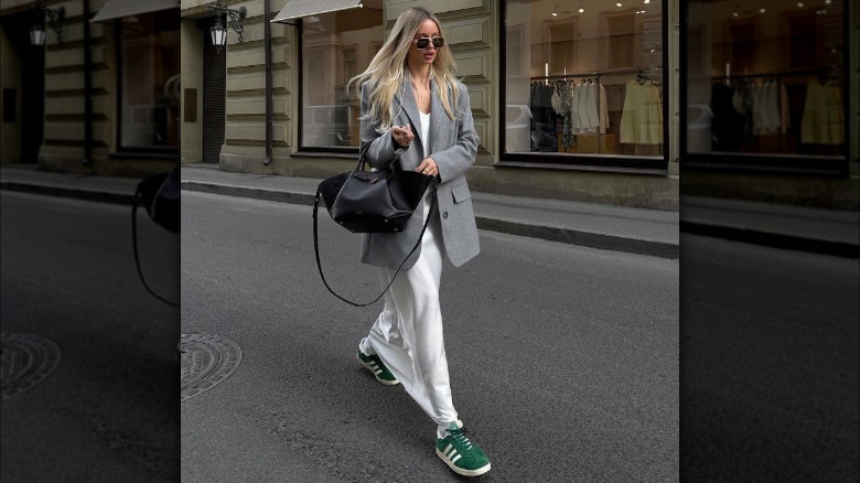 woman wearing white dress with green sneakers