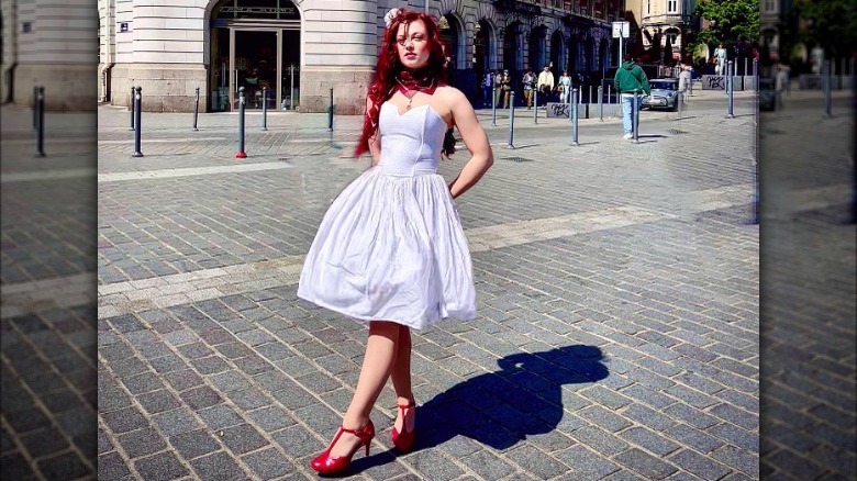 woman wearing white dress with red heels