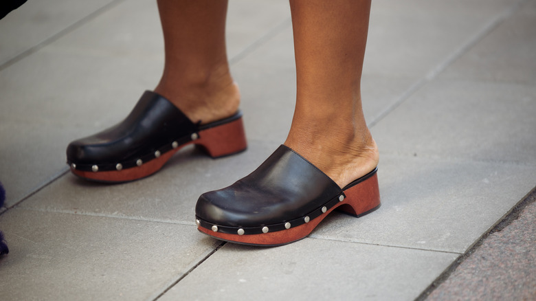 Woman wearing clogs