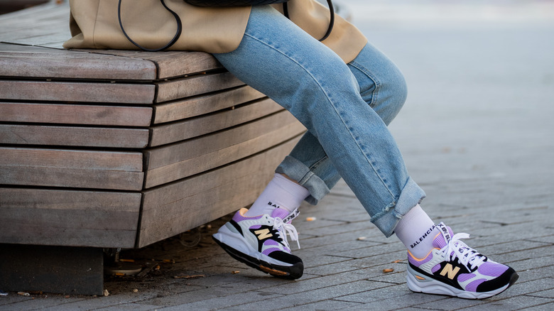 Woman wearing retro New Balance sneakers