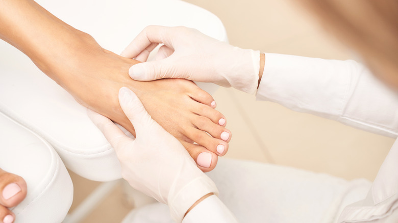 Pedicure with white nail polish