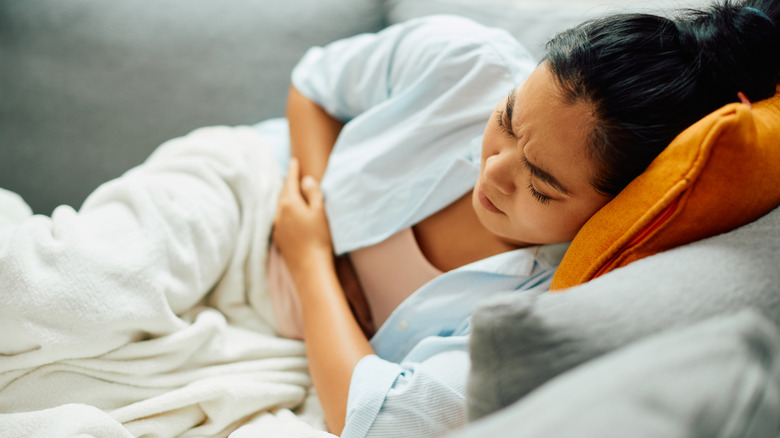 Young woman experiencing pain