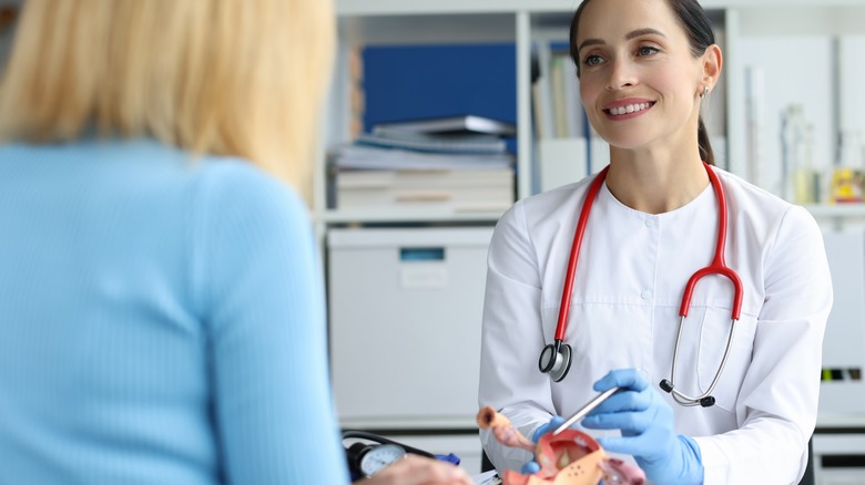 Ob-gyn talking to a patient