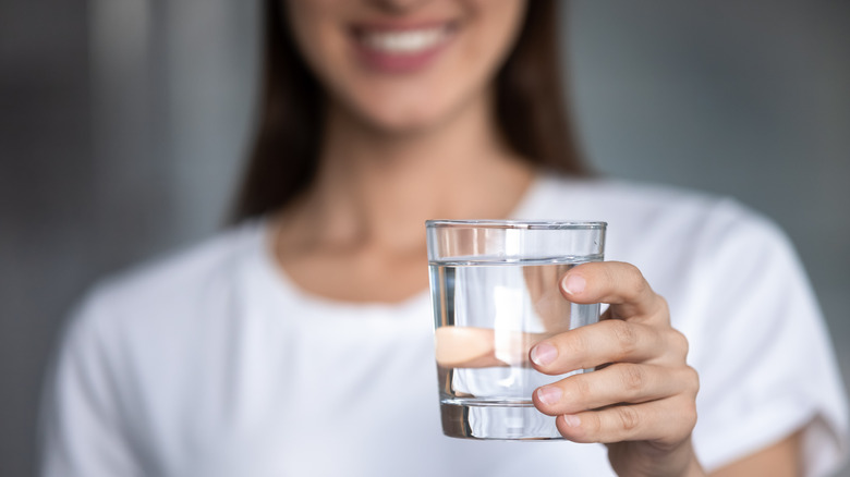 woman holding a cup of water 