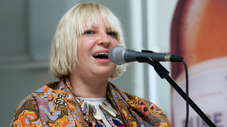 Sia speaking at an event