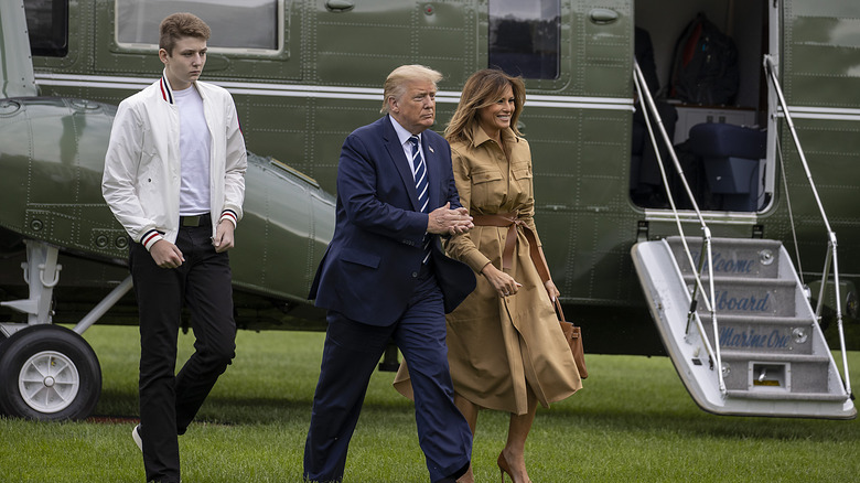 Donald Trump, Barron Trump, and Melania Trump walking together