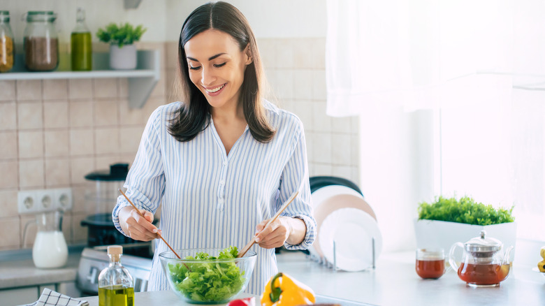 woman preparing salad