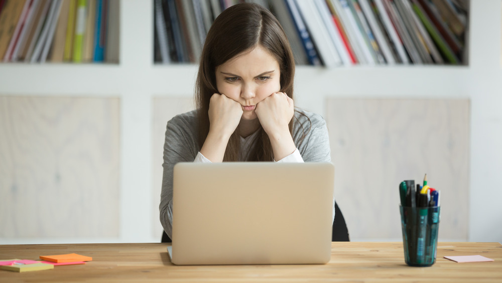 annoyed woman at desk