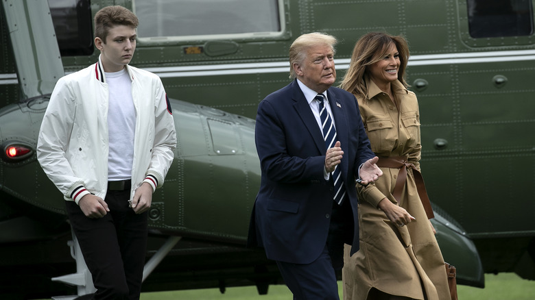 Donald, Melania, and Barron Trump walk on the South Lawn