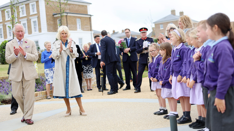 Charles and Camilla greeting crowd