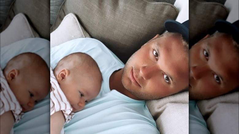 Chase Chrisley holding a baby