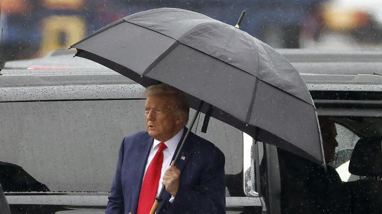 Donald Trump exits car following arraignment