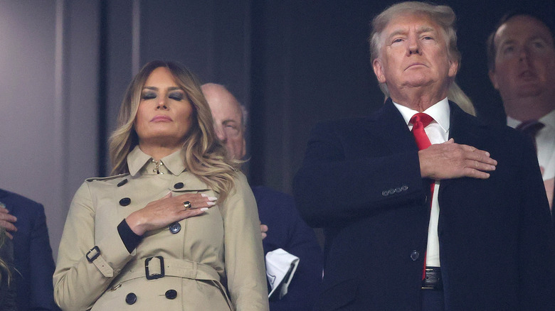 Melania and Donald Trump stand for national anthem