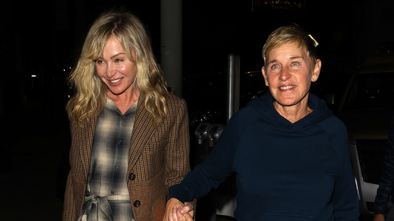 Portia de Rossi and Ellen DeGeneres holding hands