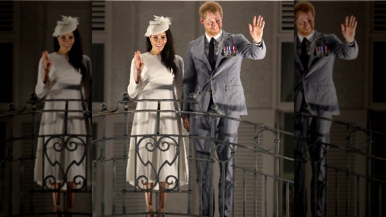 Prince Harry and Meghan Markle waving