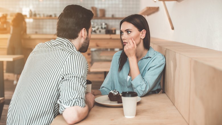 man and woman talking