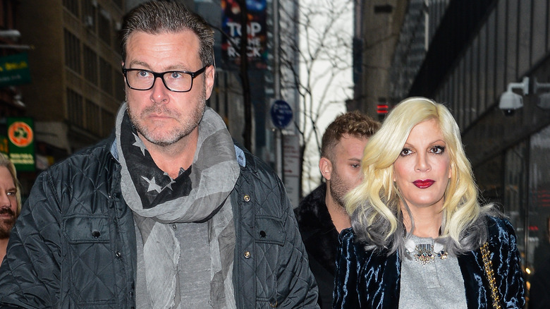 Tori Spelling and Dean McDermott frowning 