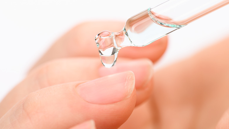 Oil being applied to nails 