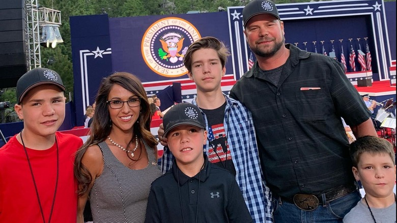 Lauren and Jayson Boebert smiling with their four sons