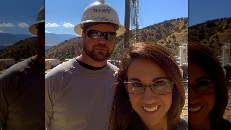 Selfie of Lauren Boebert smiling in glasses with Jason Boebert wearing a hard hat