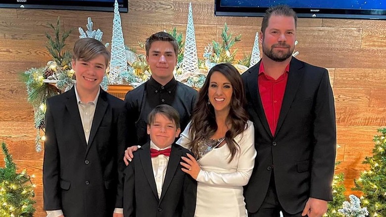 Lauren and Jayson Boebert smiling with three of their sons