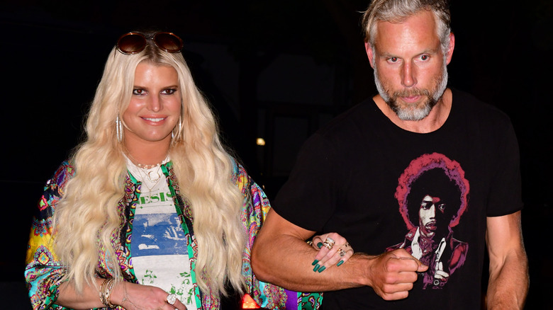 Jessica Simpson smiling and Eric Johnson with a straight face walk arm in arm seen on the streets of Manhattan