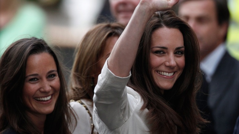 Pippa and Kate Middleton smiling