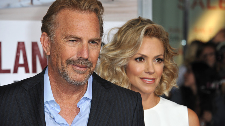 Kevin Costner and Christine Baumgartner smiling