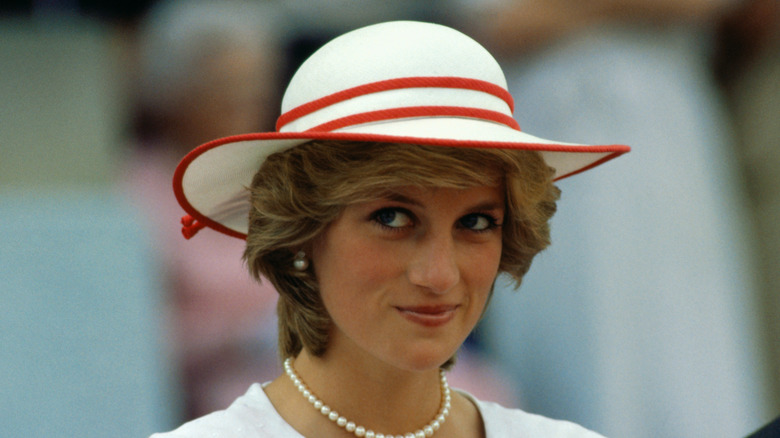 Princess Diana in red and white hat 