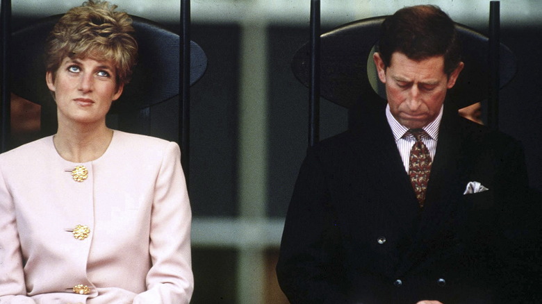 Princess Diana and King Charles III seated 