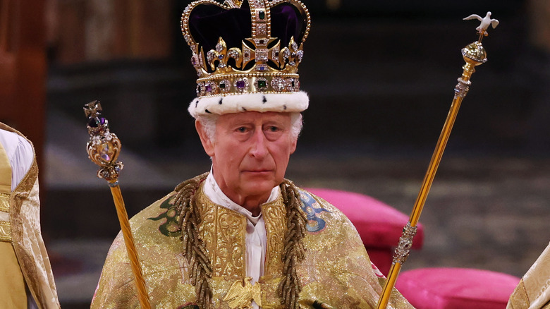 King Charles with his crown and scepters at coronation