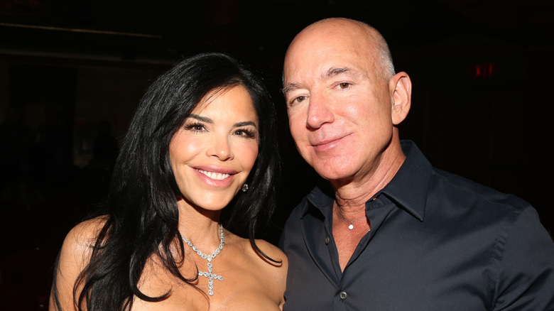 Lauren Sánchez and Jeff Bezos smiling for photos