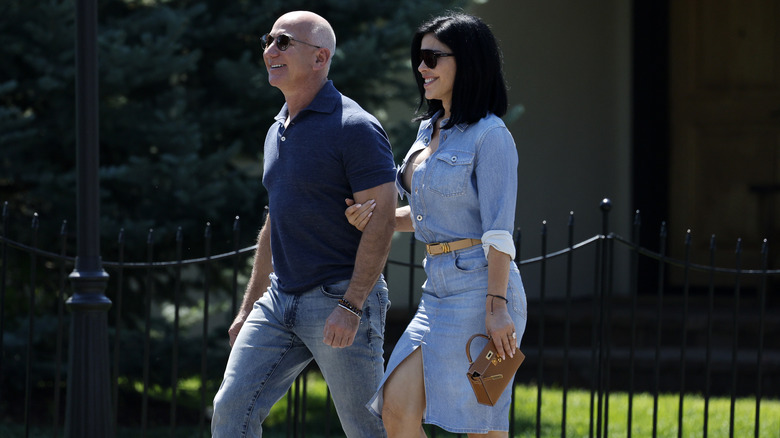 Jeff Bezos and Lauren Sánchez smiling on a walk