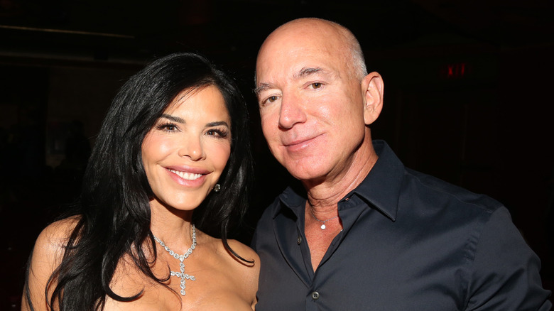 Lauren Sanchez and Jeff Bezos smiling for photos