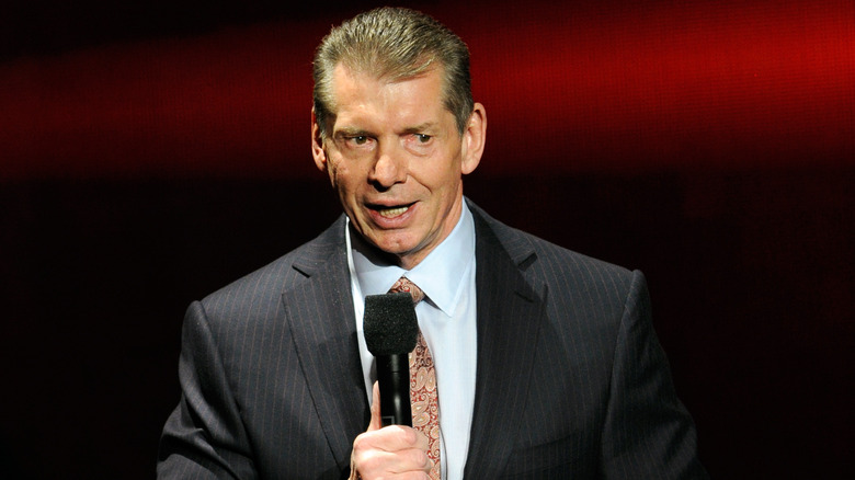 Vince McMahon holding microphone