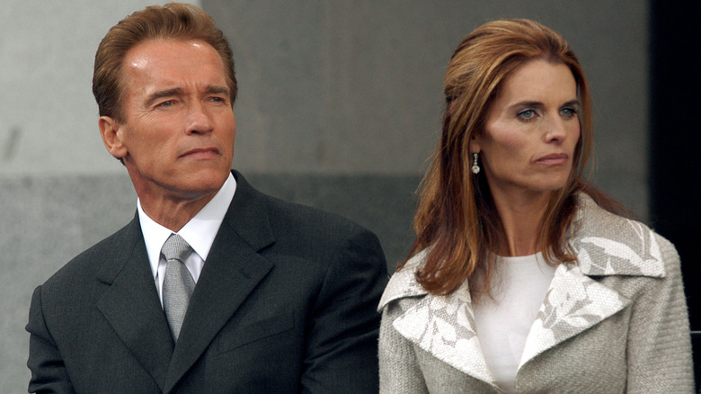 Arnold Schwarzenegger and Maria Shriver holding hands