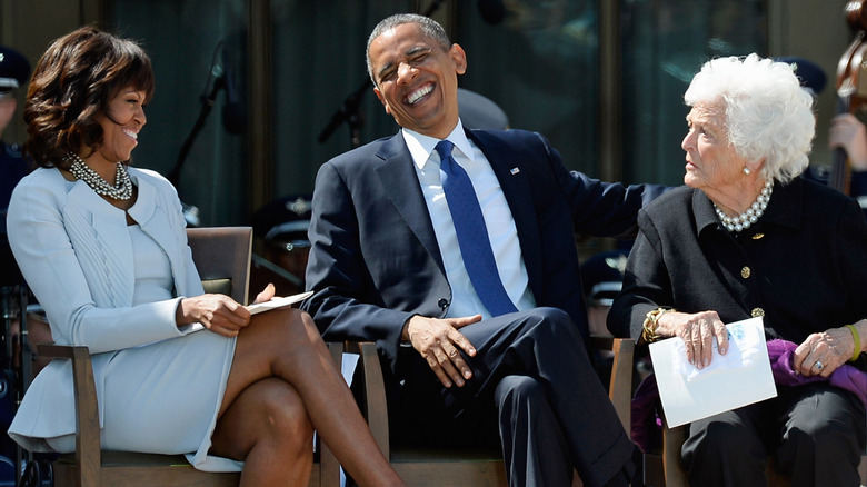 Michelle Obama, Barack Obama, and Barbara Bush share a laugh