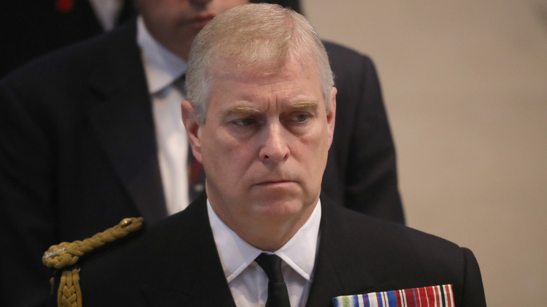 Prince Andrew looking solemn