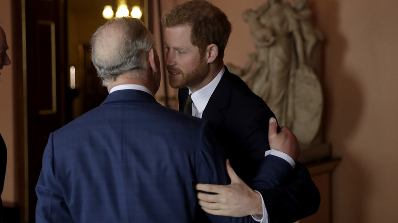 Prince Harry greeting King Charles III