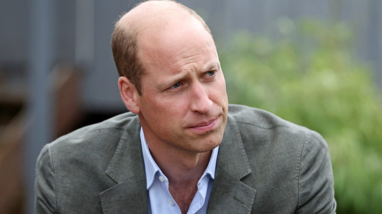 Prince William listening intently